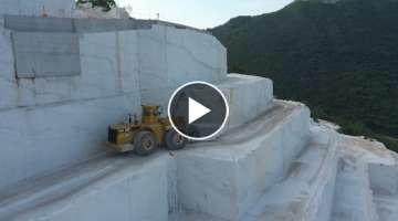 Komatsu And Caterpillar Wheel Loaders Working On Birros Marble Quarries - Aerial View
